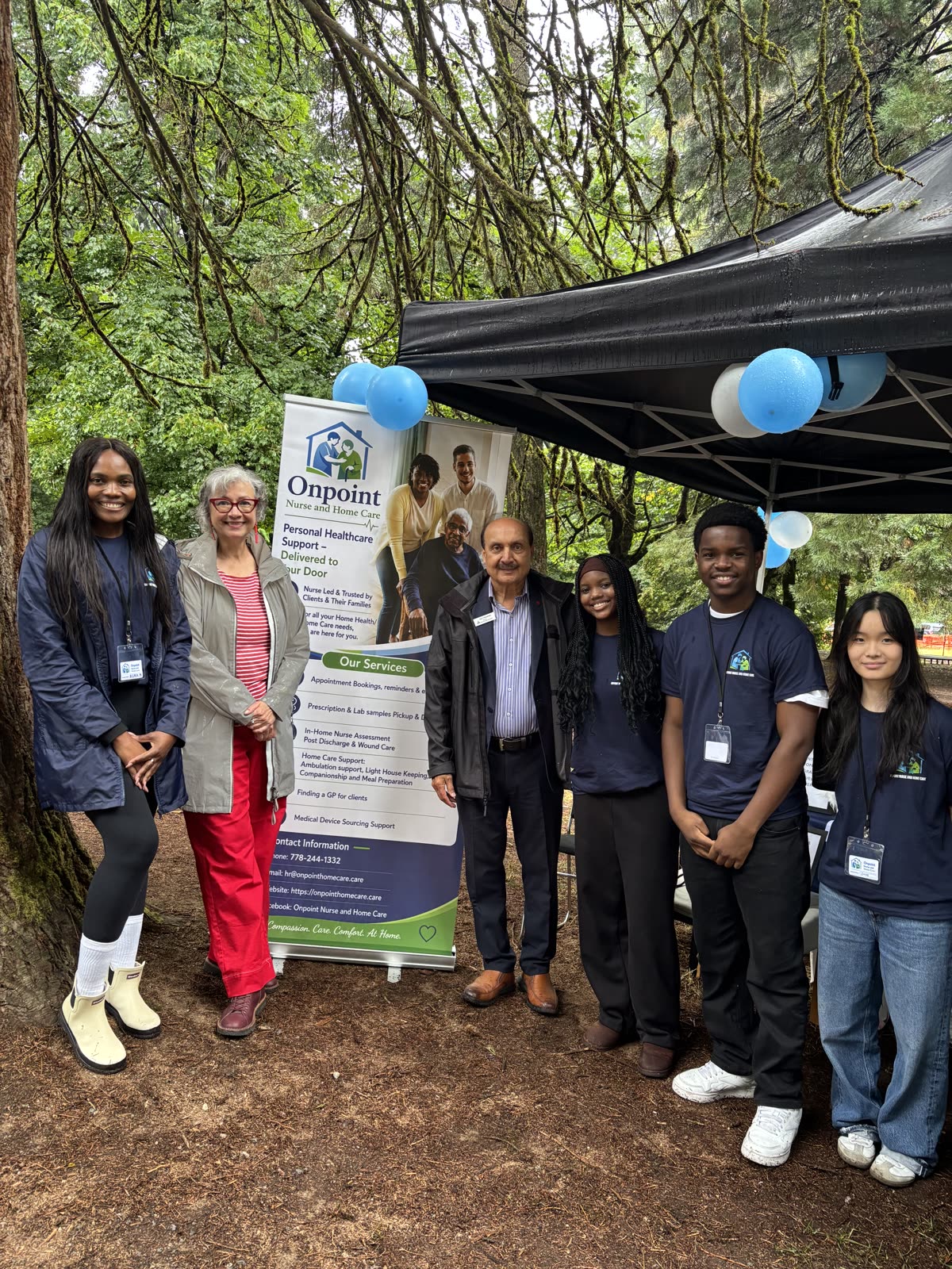 The OnPoint Nurse & Home Care team with community members and local representatives at a health outreach event in Burnaby